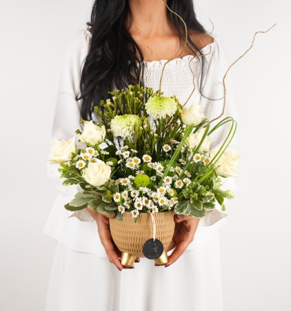 A person receiving a flower bouquet  